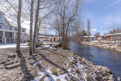 View of backyard with river flowing south.  FIsh and feed the resident ducks.