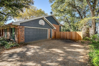 Garage featuring concrete driveway