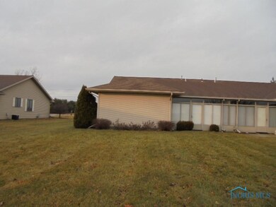Back of condo and yard.