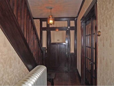 Entry/Foyer. All original woodwork and hardwood fl
