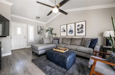 Great room plan features ceiling fan, 'wood' plank