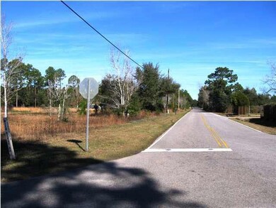 Facing north on Crow Rd. Property is to the left.
