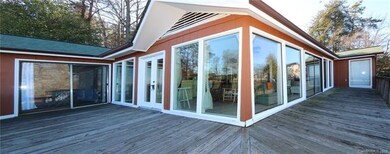 Bedrooms are on either end, windows all face the w