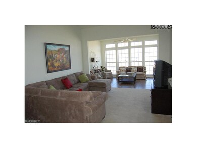 Bright, open, spacious great room opens to sunroom