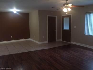 View from the living room of the front entry door with entrance to the garage.