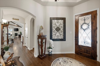 Entryway with dark hardwood / wood-style floors