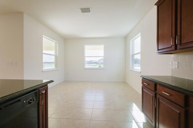 Dining area as viewed from kitchen.  Dining area has water view.