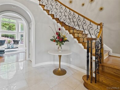 A WOW 2 story entry with curved staircase, arch ca