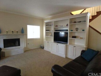Another view of the living room w/ fireplace