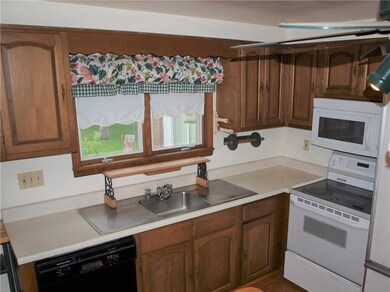 Kitchen overlooks the back yard.  Nicely sized and
