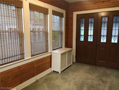 doors off this room leading to covered back porch