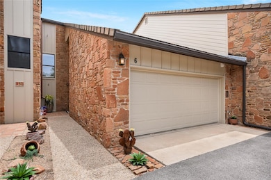 Garage featuring driveway