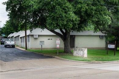 View of property featuring a wall mounted air cond