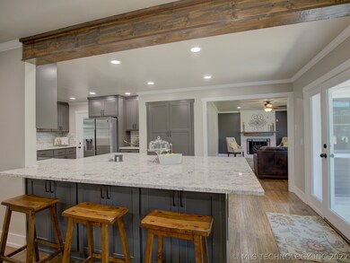 Huge granite topped island can seat up to eight.