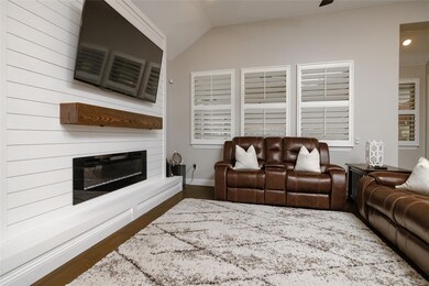 Living area featuring a fireplace, recessed lighti