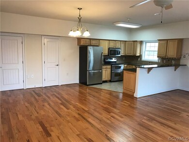 Kitchen and Dining Area, Pantry and half bath to l