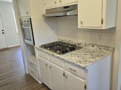 Kitchen updated with new gas stove top, wall oven,