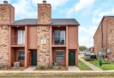 View of front facade with central AC, a chimney, b