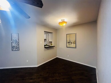 Unfurnished room with dark hardwood / wood-style f