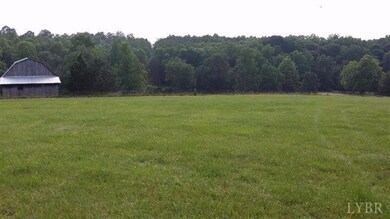 Large beautiful open field, fenced area mostly level to sloping gently near back edge