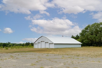 56x60 pole building with partial concrete floor - 5 overheads with one 14'.jpg