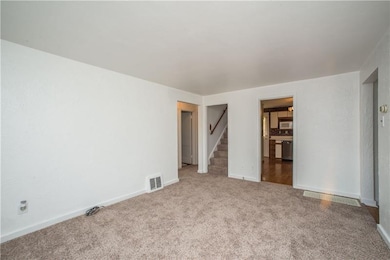 The foyer has a coat closet with hardwood flooring