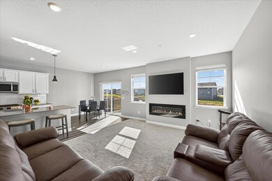 Open concept main level w/ electric fireplace.