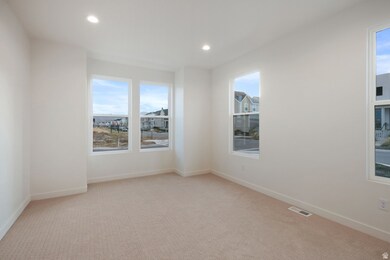 Unfurnished room featuring light carpet and recessed lighting
