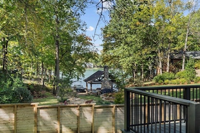 Deck featuring view of scattered trees