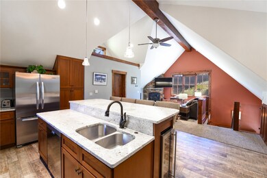 Kitchen featuring freestanding refrigerator, a sin