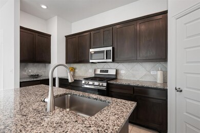 Kitchen featuring appliances with stainless steel