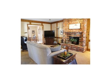 Large brick fireplace in Family Room.French doors 