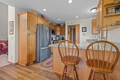 Stainless Steel Appl the filtered water dispenser is inside fridge to the left, ice maker in freezer