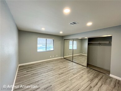 Unfurnished bedroom with a closet, baseboards, rec
