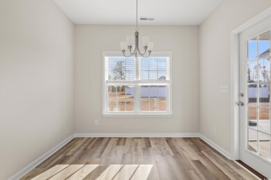Unfurnished dining area featuring a notable chande