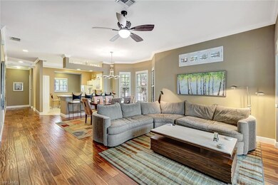 Living area open to dining area with light coming 