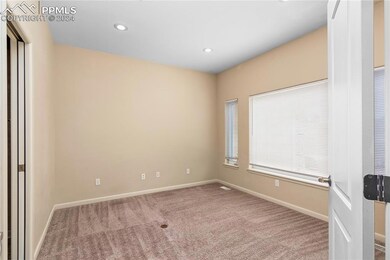Unfurnished room with light colored carpet