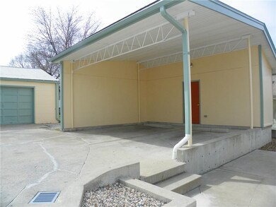 Not your typical carport!  This offers two storage