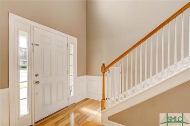 Front entry way. Beautiful hardware floors through