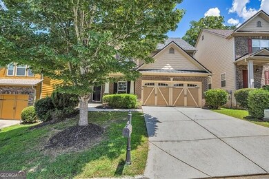 Craftsman inspired home featuring concrete driveway, an attached garage, a shingled roof, and brick siding