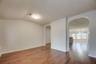As you enter, you'll be greeted by the elegant sight of the formal living room.
