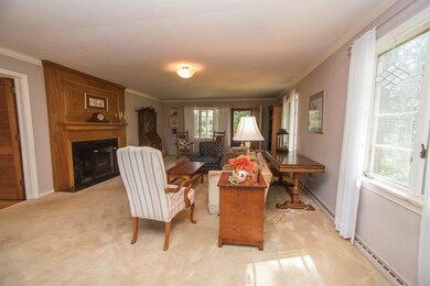 Large living room with wood burning fireplace