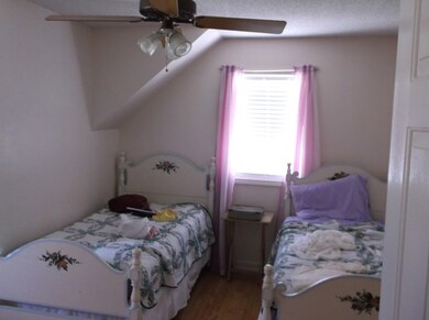 Upstairs bedroom with twin beds