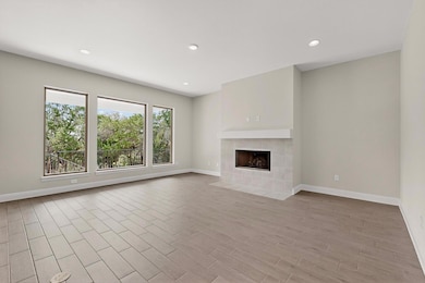 Unfurnished living room with a fireplace, recesse