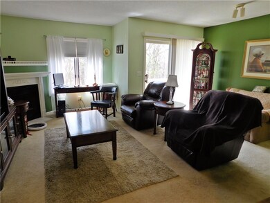 Living Room with gas fireplace and sliders to deck