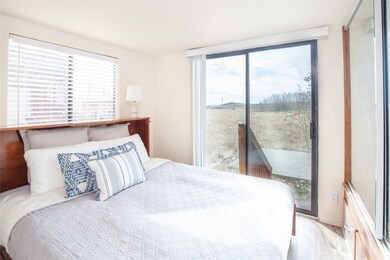 The bedroom sliders have an expansive view of the