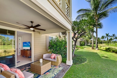Step out from the living room onto your private lanai—complete with a cozy conversation set, sweeping views of Mauna Kea, and unforgettable Hawaiian sunsets that warm the sky each evening.