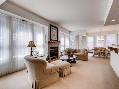 Spacious & open living room with fireplace & walk-