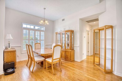 Dining room featuring baseboards, light wood finis
