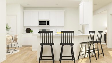 Kitchen with a kitchen bar, appliances with stainl